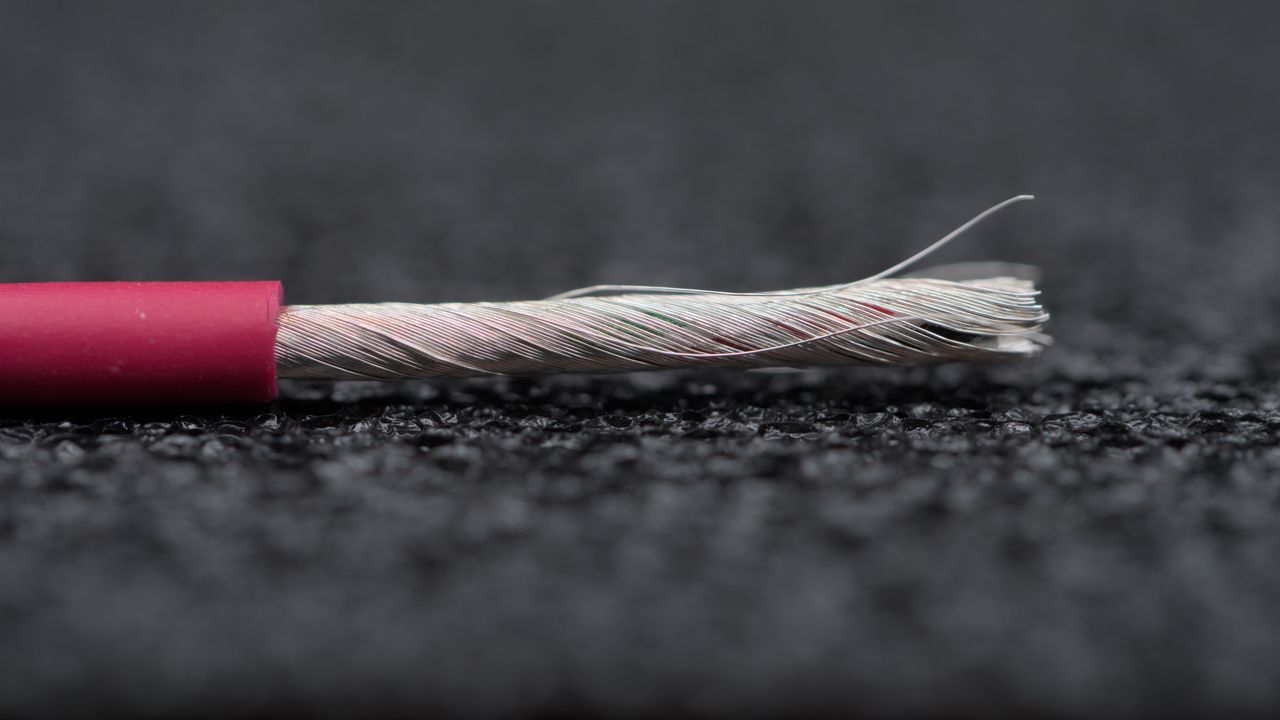 A rolled up M2S cable, showcasing the red PU jacket.
