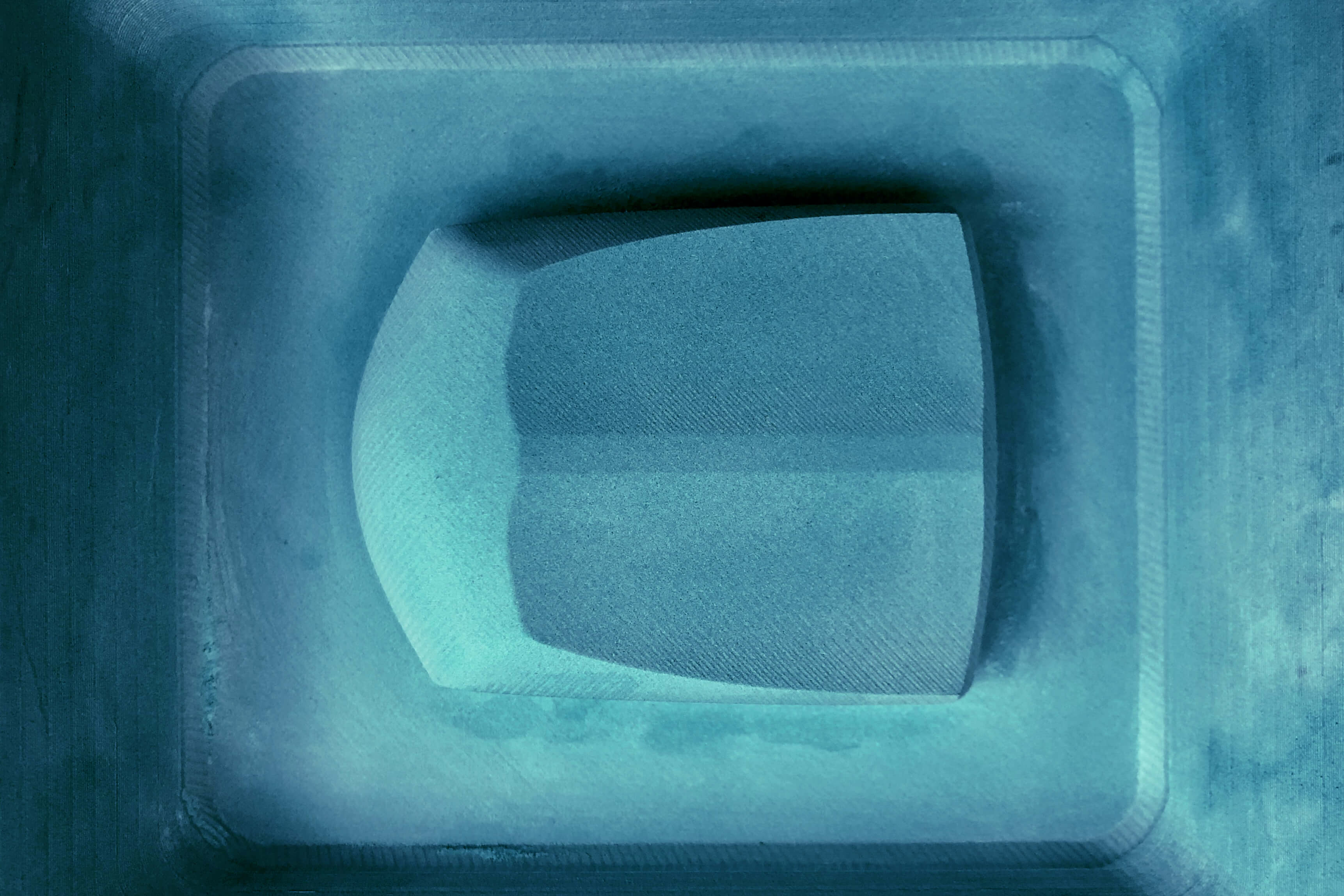 This picture shows the creation of the master mold, the first step in making carbon fiber parts.